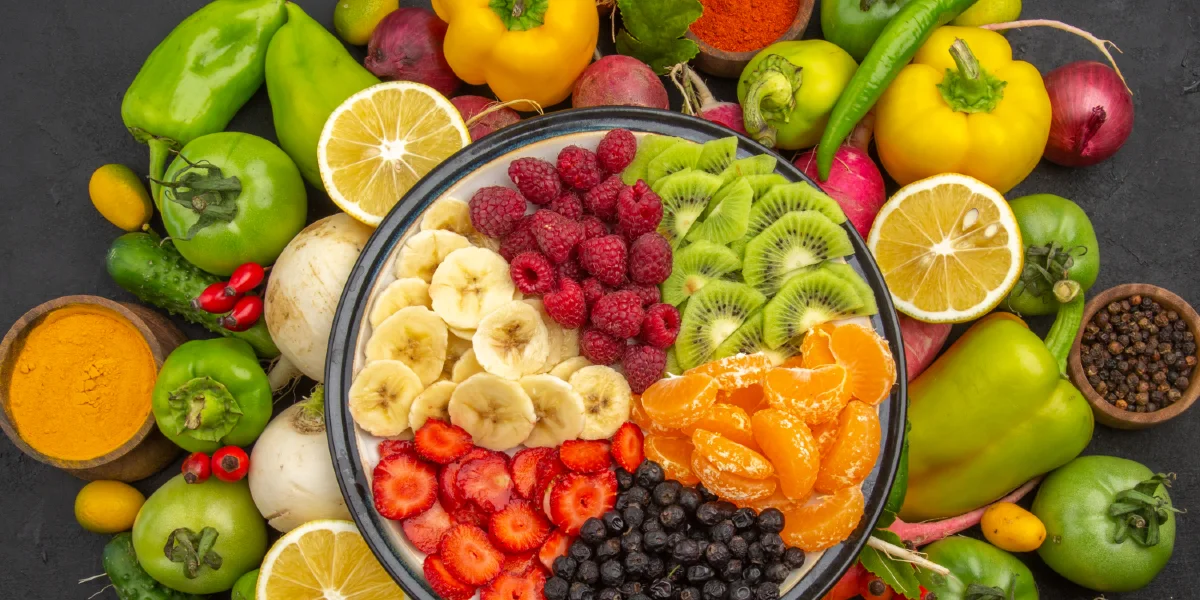 top-view-delicious-fruit-salad-inside-plate-with-fresh-fruits-dark-tropical-fruit-1200x600-1